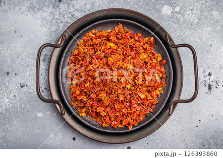 Dried Tomato Flakes, Indian and Arabic spices for cooking. grey background. top view 126393860