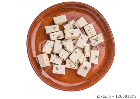 Uncooked Diced soybean tofu cheese on plate isolated on white background. top view Uncooked Diced soybean tofu cheese on plate isolated on white background. top view 126393878