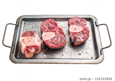 Raw ossobuco cuts, veal shank meat, the ultimate ingredient for rich stews and classic Italian comfort food delights. isolated on white background. top view Raw ossobuco cuts, veal shank meat, the ultimate ingredient for rich stews and classic Italian comfort food delights. isolated on white background. top view 126393889