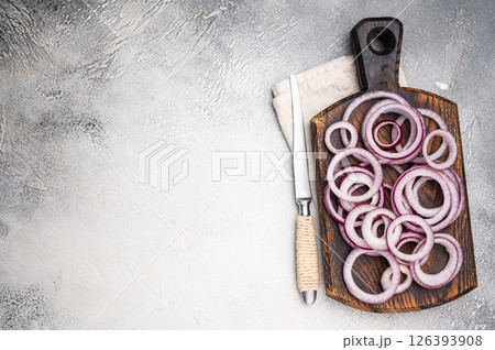 Sliced rings of red onion or purple onion. grey background. top view Sliced rings of red onion or purple onion. grey background. top view 126393908