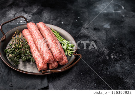 Fresh minced beef and lamb kebabs with fresh spices, arabic kofta kofte kebab. black background. top view 126393922