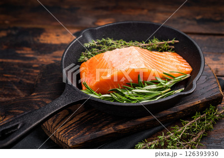 Ready for cooking Fresh Salmon fillets, raw fish steaks in a pan. wooden background. top view 126393930