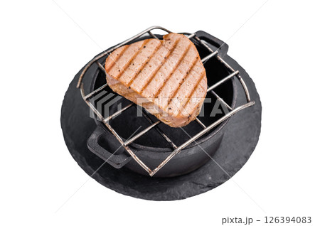 Juicy grilled tuna steak, perfectly seared with a smoky flavor, ideal for seafood lovers and gourmet dishes. isolated on white background. top view 126394083
