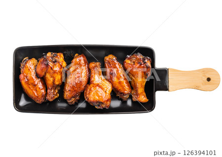 Juicy barbecue chicken wings, perfectly grilled and glazed, ideal for your next summer cookout or party. isolated on white background. top view 126394101