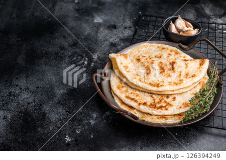 Aloo Paratha Indian Potato stuffed Flatbread. black background. top view 126394249