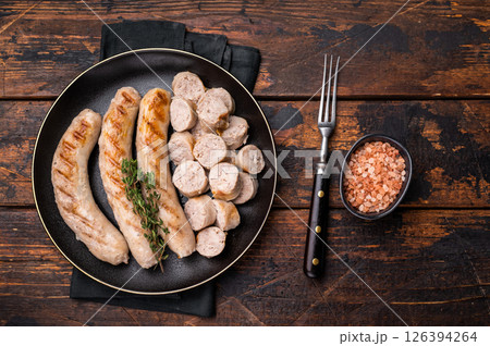Grilled Sausages with forcemeat mincemeat and herbs in plate. wooden background. top view Grilled Sausages with forcemeat mincemeat and herbs in plate. wooden background. top view 126394264