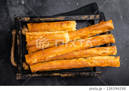 Bread sticks with cheese and salt. black background. top view Bread sticks with cheese and salt. black background. top view 126394298