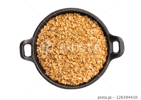 Raw buckwheat flakes in a skillet isolated on white background. top view 126394410