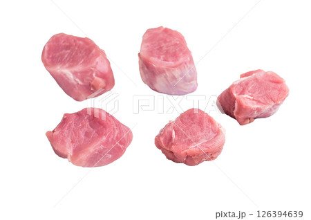 Uncooked pork loin medallion, cut tenderloin ready to be seasoned and cooked into a delicious gourmet dish. isolated on white background. top view 126394639