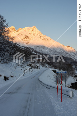 Road and mountain in the winter sunrise, Norway 126394702