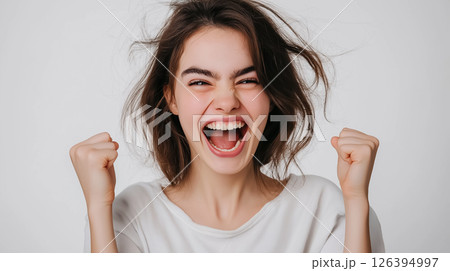 A studio portrait of a girl with a mischievous smirk, one eyebrow raised, radiating playful energy A studio portrait of a girl with a mischievous smirk, one eyebrow raised, radiating playful energy 126394997