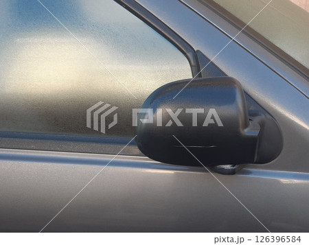 Side rear-view mirror closed for safety - close up shot 126396584