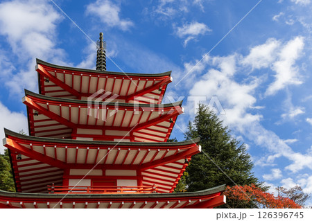Chureito Pagoda stand against a bright blue sky with scattered clouds 126396745