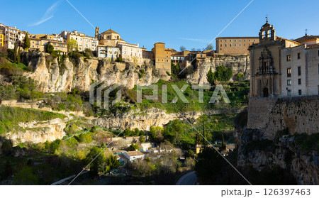 Cuenca city on rocks with hanging houses overlooking entrance to church of convent Cuenca city on rocks with hanging houses overlooking entrance to church of convent 126397463