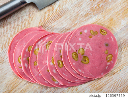 Slices of Mortadella with olives 126397539
