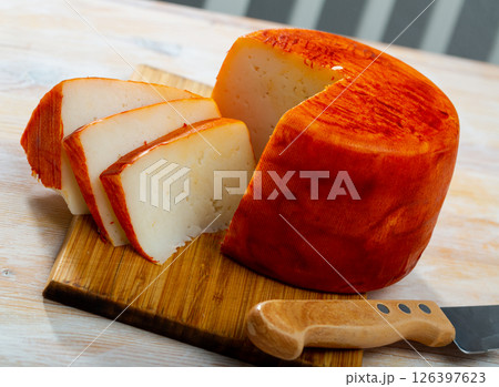 Tasty french goat cheese with pepper at wooden desk 126397623