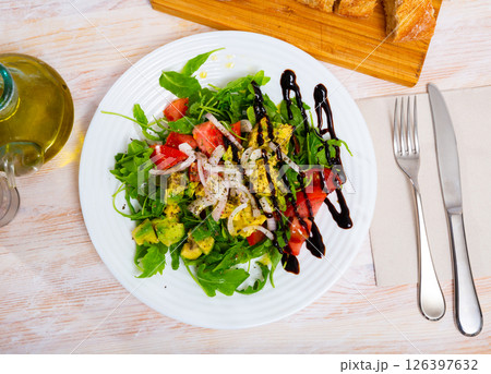 Salad with fresh tomatoes, avocado 126397632