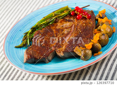 Roasted veal steak with baked vegetables Roasted veal steak with baked vegetables 126397710