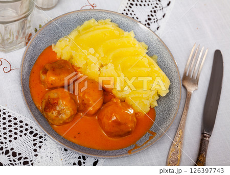 Meatballs with mashed potatoes beautifully served with some gravy Meatballs with mashed potatoes beautifully served with some gravy 126397743