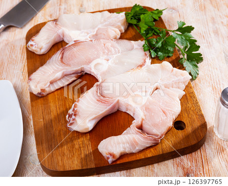 Raw seafood, fresh tiger shark fillet on board Raw seafood, fresh tiger shark fillet on board 126397765