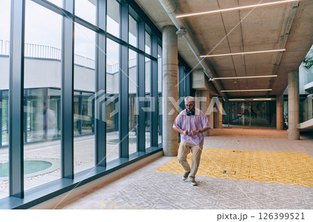 Amidst an atmosphere of exuberance, a joyful, blonde man energetically departs for a business meeting, radiating positivity, enthusiasm, and a vibrant spirit in the contemporary corporate world Amidst an atmosphere of exuberance, a joyful, blonde man energetically departs for a business meeting, radiating positivity, enthusiasm, and a vibrant spirit in the contemporary corporate world 126399521