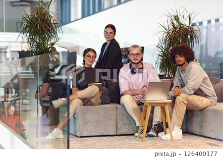 In a modern startup office, a diverse group of young professionals collaboratively tackles various business problems and challenges, surrounded by their engaged colleagues, fostering innovation and In a modern startup office, a diverse group of young professionals collaboratively tackles various business problems and challenges, surrounded by their engaged colleagues, fostering innovation and 126400177