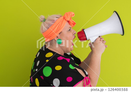 Colorful Retro Woman Shouting Through a Megaphone Colorful Retro Woman Shouting Through a Megaphone 126400388