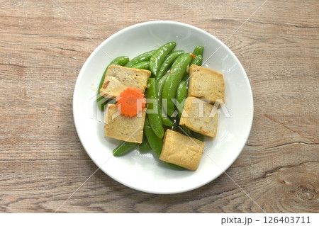 stir fried garden pea and carrot with slice tofu in soy sauce vegetarian food on dish 126403711