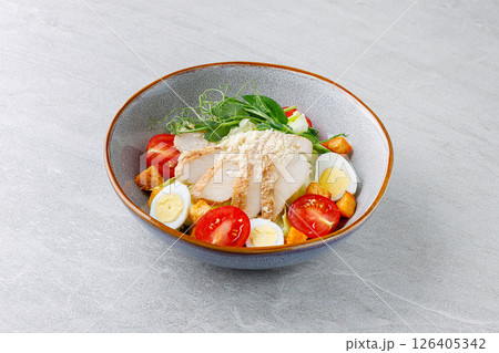 Chicken Salad with Eggs Tomatoes and Croutons in Ceramic Bowl Chicken Salad with Eggs Tomatoes and Croutons in Ceramic Bowl 126405342