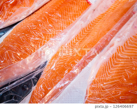 Salmon fillet in a vacuum package plastic bag. Salmon fillet in a vacuum package plastic bag. 126406697