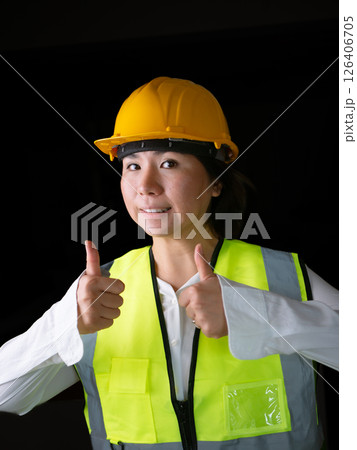 factory woman workers or technicians civil Engineer or Architecture project management give thumb up. factory woman workers or technicians civil Engineer or Architecture project management give thumb up. 126406705