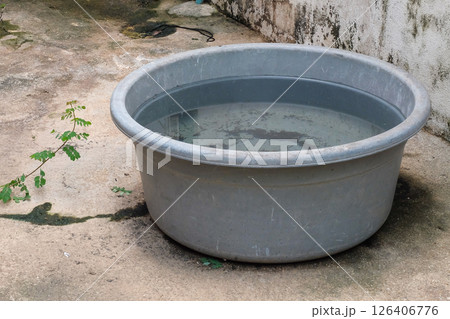 Rainwater catch basin,Rainwater stored in a bucket. Rainwater catch basin,Rainwater stored in a bucket. 126406776