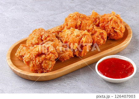 Crispy Fried Chicken Bites with Sweet Chili Dip on Bamboo Plate 126407003