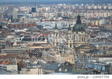 Ferris wheel standing tall in the bustling cityscape of Budapest, Hungary Ferris wheel standing tall in the bustling cityscape of Budapest, Hungary 126407700