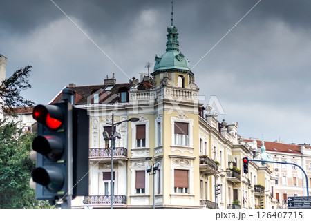 Red traffic light in Belgrade showing stop sign with european architecture in background Red traffic light in Belgrade showing stop sign with european architecture in background 126407715