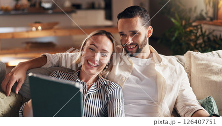 Woman, man and tablet with smile on sofa, relax and streaming with film, show or comedy in home. Couple, happy and digital touchscreen with application for social media, movies or series at apartment 126407751