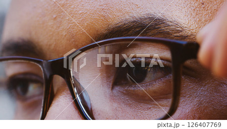 Eyes, thinking and person with glasses closeup for optometry, wellness and vision correction. Planning, zoom and remove spectacles for eyesight health, eyecare and reflection for idea or decision 126407769