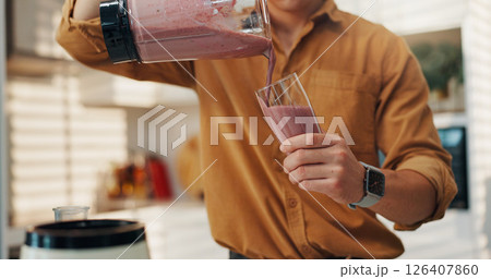 Hands, smoothie and man in kitchen, blender and nutrition with wellness, fruit drink and gut health. Benefits, closeup and person with organic ingredients, detox and weight loss with vitamins or home Hands, smoothie and man in kitchen, blender and nutrition with wellness, fruit drink and gut health. Benefits, closeup and person with organic ingredients, detox and weight loss with vitamins or home 126407860