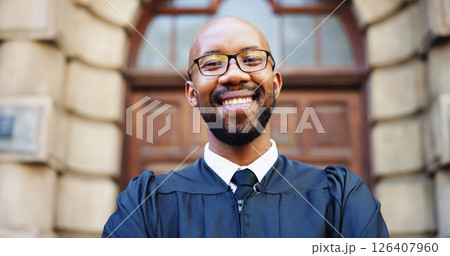 Portrait, smile and black man judge in city for trial report, policy legislation and legal documents. Lawyer, attorney and confidence with happy person at courtroom outdoor for government justice 126407960