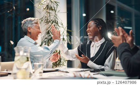 Meeting, high five and excited business people, success and winning finance deal at night. Teamwork, cheers and happy women with financial seminar, celebration and achievement at funding workshop 126407986