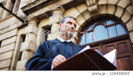 Thinking, judge and mature man with court, confidence and pride for career ambition and success. Person, low angle and attorney with lawyer, constitution and law firm for justice system knowledge 126408093