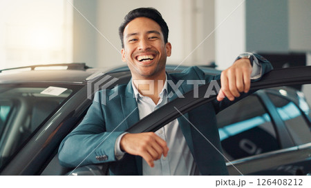 Happy man, face and salesman with confidence at car dealership for promotion, discount and offer. Seller, agent and proud broker in portrait for business and display vehicle at showroom in Mexico 126408212