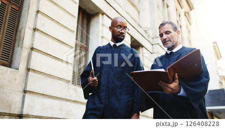 Men, judge and book in city outdoor for courtroom discussion, constitution and justice procedure. People, lawyers and trial report for investigation, hearing process and information of jury statement 126408228