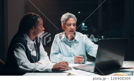 Business, women and meeting with laptop at night for planning, financial report and accounting deadline. People, team and online for finance budget, schedule update and information for working late 126408304