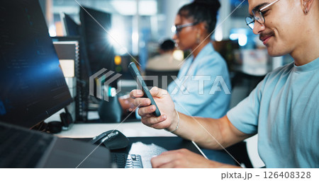 Computer, businessman and programmer with mobile in office, coding software and download app. Coworking, male person and developer with smartphone for web analytics, seo update and typing on break Computer, businessman and programmer with mobile in office, coding software and download app. Coworking, male person and developer with smartphone for web analytics, seo update and typing on break 126408328