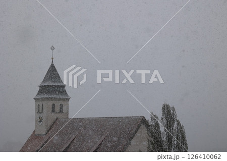 A church steeple covered in snow 126410062