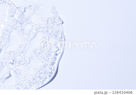 The texture of a moisturizing cosmetic gel or skin serum. Copy space 126410406