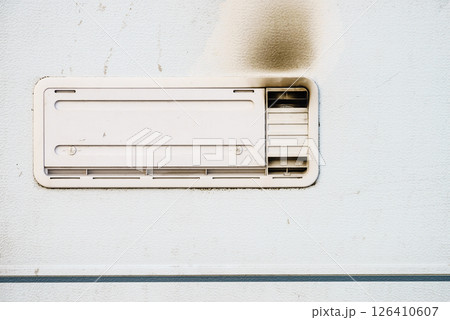 Camper car detail. Grid, ventilation plate for fridge with smoke 126410607