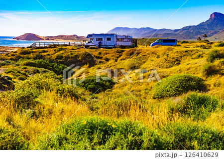 Coast view with camper rv camping on sea shore, Spain 126410629