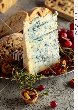 Gorgonzola with ciabatta, walnuts, red grapes, and thyme. 126411048